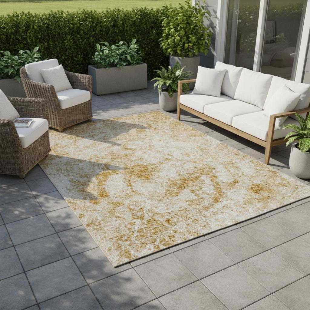 Outdoor patio with wicker furniture, sofa, and decorative rug on a tiled floor.